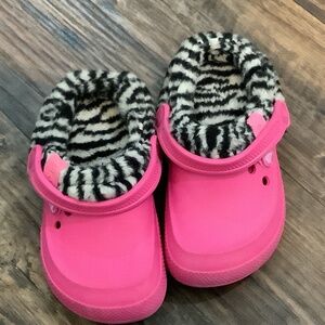 Crocs with REMOVABLE fur lining.  Pink with zebra stripes! Size 10/11 toddler